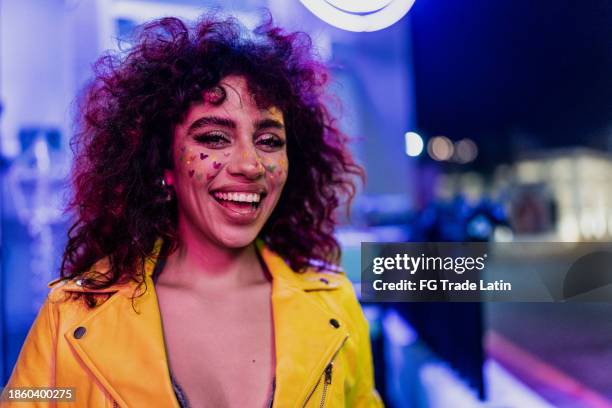 portrait of a young woman outdoors - neon lighting smiling stock pictures, royalty-free photos & images