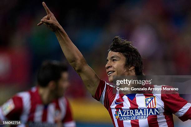 Oliver Torres of Atletico de Madrid celebrates scoring their opening goal during the La Liga match between Club Atletico de Madrid and Real Betis...