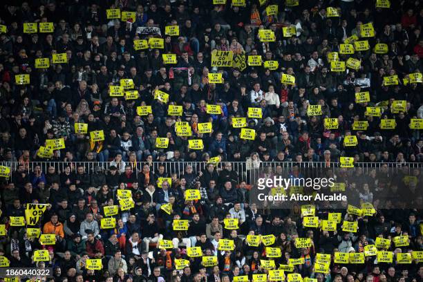 General view as fans of Valencia CF hold up signs which read "Lim Go Home" during the LaLiga EA Sports match between Valencia CF and FC Barcelona at...