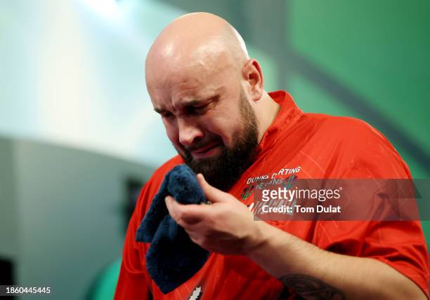 Jamie Hughes of England celebrates after victory in his First Round match against David Cameron of Canada on Day Two of 2023/24 Paddy Power World...