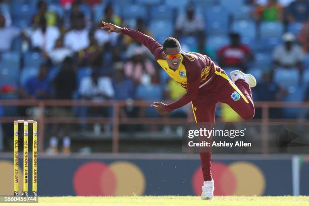 Akeal Hosein of West Indies bowls during the 3rd T20 International match between West Indies and England at the National Cricket Stadium on December...