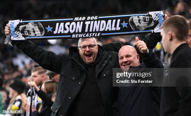 Newcastle fan in the Gallowgate End holds aloft a scarf which reads 'Mad Dog Jason Tindall' after the Premier League match between Newcastle United...