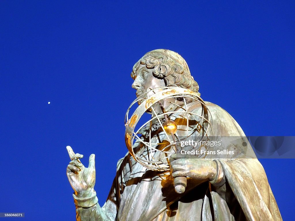 Copernicus pointing to a planet (Venus?)