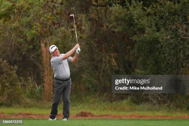 Mark O'Meara of the United States plays his shot on the ninth hole during the first round of the PNC Championship at The Ritz-Carlton Golf Club on...