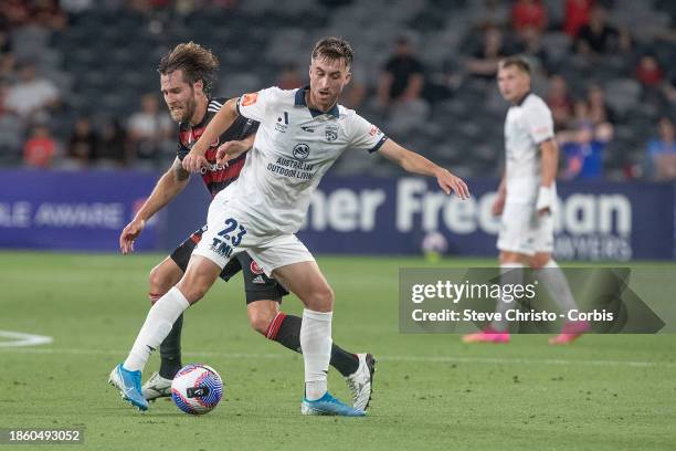 Luke Duzel of United competes with Wanderers Joshua Brillante during the A-League Men round eight match between Western Sydney Wanderers and Adelaide...