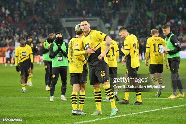 Giovanni Reyna and Niklas Süle of Borussia Dortmund hug after the Bundesliga match between FC Augsburg and Borussia Dortmund at WWK-Arena on December...