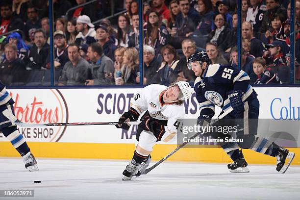Sami Vatanen of the Anaheim Ducks reacts after being hit by the high-stick of Mark Letestu of the Columbus Blue Jackets during the first period on...
