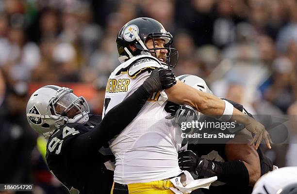 Ben Roethlisberger of the Pittsburgh Steelers is pressured by Kevin Burnett and Vance Walker of the Oakland Raiders at O.co Coliseum on October 27,...