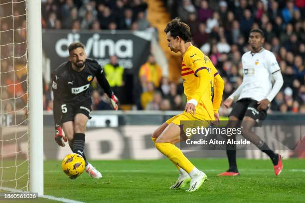 Joao Felix of FC Barcelona scores their team's first goal during the LaLiga EA Sports match between Valencia CF and FC Barcelona at Estadio Mestalla...