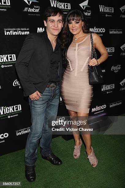 Julian Figueroa and Maribel Guardia attend the "Wicked" red carpet at Teatro Telmex on October 17, 2013 in Mexico City, Mexico.
