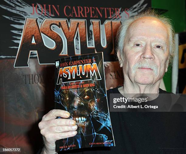 Director John Carpenter sign copies of his first comic book "Asylum" held at Golden Apple Comics on October 27, 2013 in Los Angeles, California.