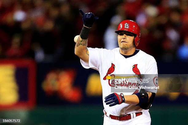 Yadier Molina of the St. Louis Cardinals celebrates after he hit double to deep right against Clay Buchholz of the Boston Red Sox in the second...