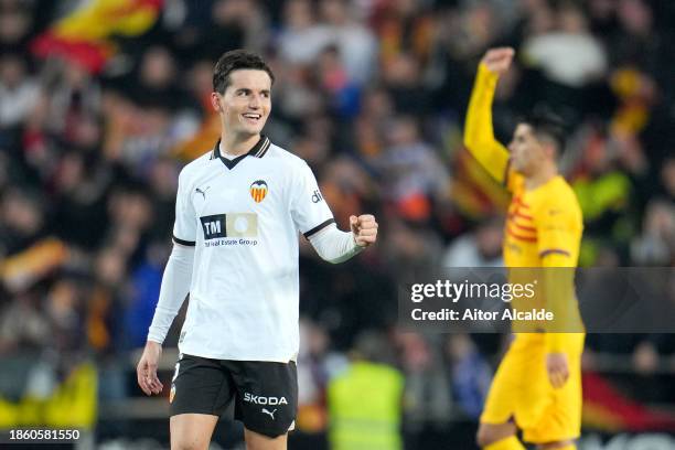 Hugo Guillamon of Valencia CF celebrates after scoring their team's first goal during the LaLiga EA Sports match between Valencia CF and FC Barcelona...