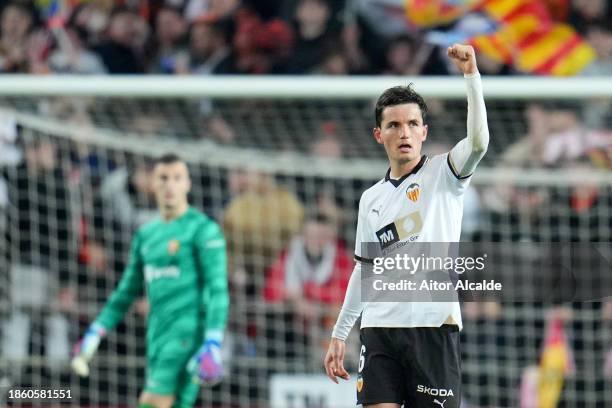 Hugo Guillamon of Valencia CF celebrates after scoring their team's first goal during the LaLiga EA Sports match between Valencia CF and FC Barcelona...