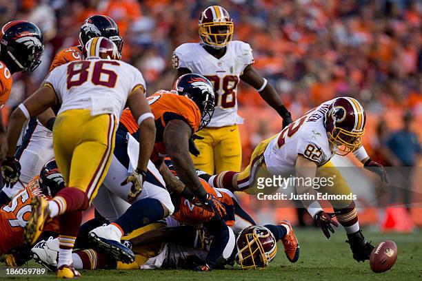 Tight end Logan Paulsen of the Washington Redskins recovers a fumble by the offense during the fourth quarter against the Denver Broncos at Sports...