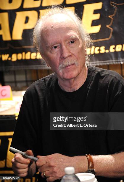 Director John Carpenter sign copies of his first comic book "Asylum" held at Golden Apple Comics on October 27, 2013 in Los Angeles, California.