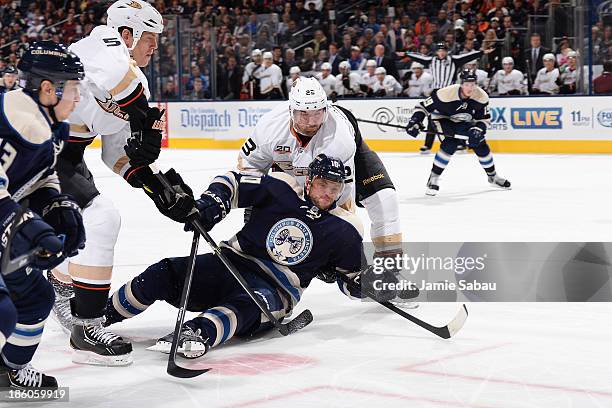 Marian Gaborik of the Columbus Blue Jackets is tripped by Francois Beauchemin of the Anaheim Ducks during the third period on October 27, 2013 at...