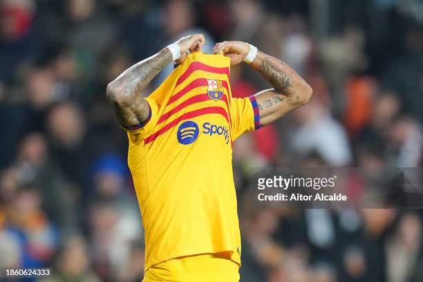 Raphinha of FC Barcelona reacts after the LaLiga EA Sports match between Valencia CF and FC Barcelona at Estadio Mestalla on December 16, 2023 in...
