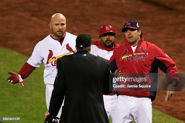 Mike Matheny of the St. Louis Cardinals argues a call with home plate umpire Paul Emmel against the Boston Red Sox during Game Four of the 2013 World...