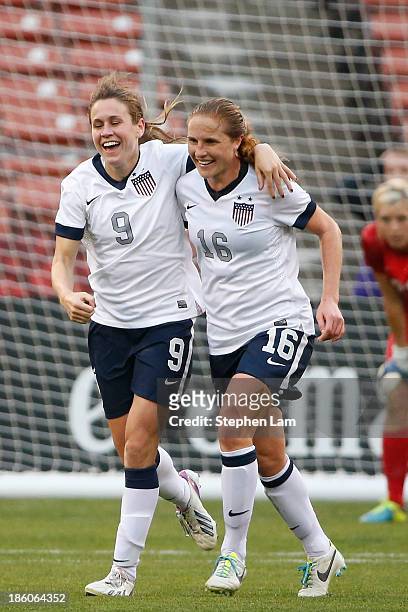 Midfielder Heather O'Reilly of the U.S. Women's National Team celebrates her goal with teammate defender Rachel Buehler during the second half of...