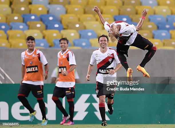 William Henrique of Vitoria celebrates a scored goal during a match between Fluminense and Vitoria as part of Brazilian Serie A 2013 at Aterro do...