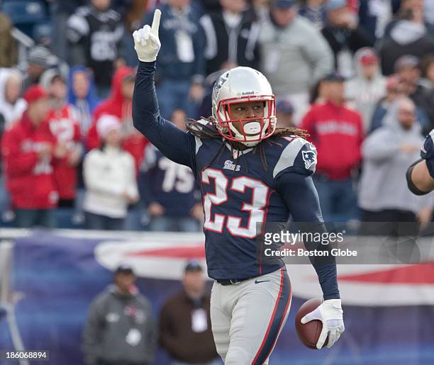 New England Patriots player Marquice Cole reacts after a sidelines interception against the Miami Dolphins during fourth quarter action at Gillette...