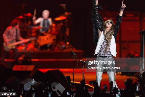 Joey Kramer and singer Steven Tyler of Aerosmith perform on stage at Arena Ciudad de México on October 27, 2013 in Mexico City, Mexico.