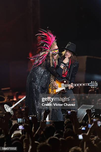 Singer Steven Tyler and Joe Perry of Aerosmith perform on stage at Arena Ciudad de México on October 27, 2013 in Mexico City, Mexico.