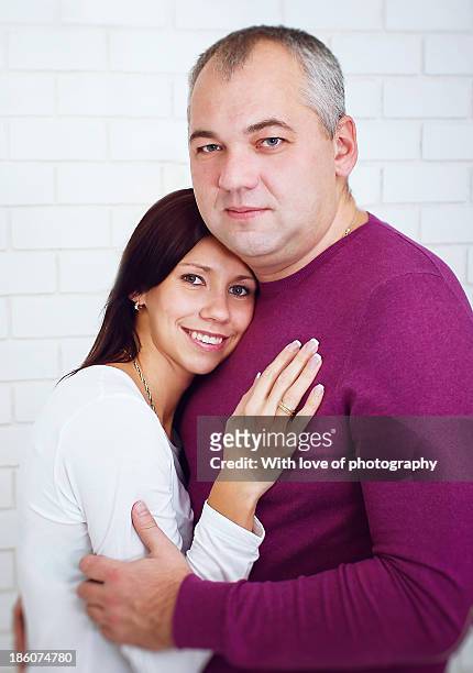 happy parents' hugs - hazel bond stock pictures, royalty-free photos & images