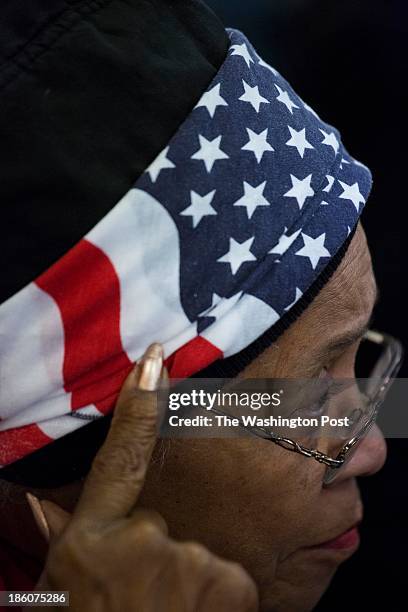 Joann Bagnerise from Dumfries, Virginia, listens to Virginia gubernatorial candidateTerry McAuliffe joined by President Bill Clinton during a...