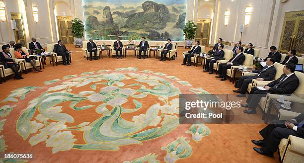 Chinese President Xi Jinping meets with visiting South African Deputy President Kgalema Motlanthe at the Great Hall of the People on October 28, 2013...