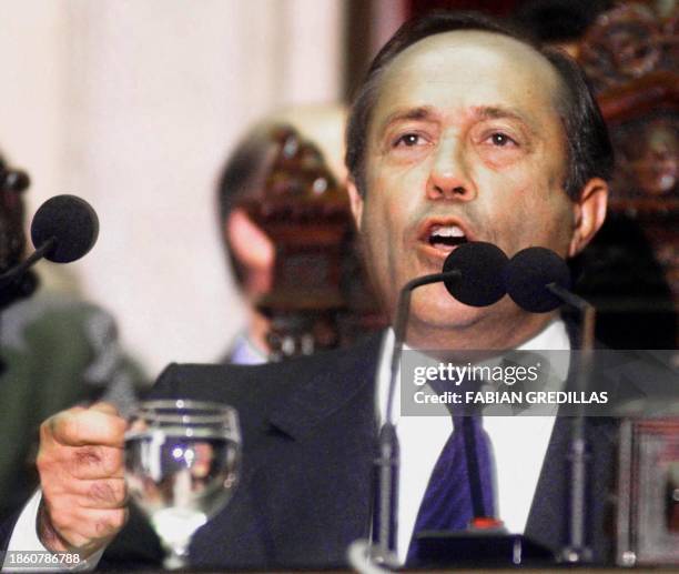 Adolfo Rodriguez Saa makes a point during his inaugural speech after he was appointed president by the Argentine Congress 23 December, 2001 in Buenos...