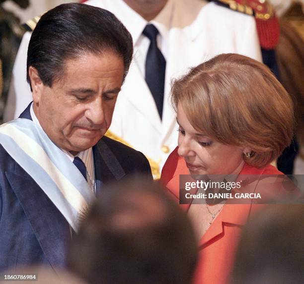 Eduardo Duhalde stands with his wife Hilda Gonzalez de Duhalde during his inauguration as president in Buenos Aires 02 January, 2002. Duhalde is...