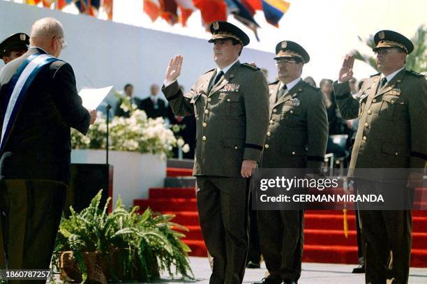 President Enrique Bolanos leads inauguration ceremonies as general Javier Carrion raises his hand in oath 10 January 2002 in Managua, Nicaragua. El...