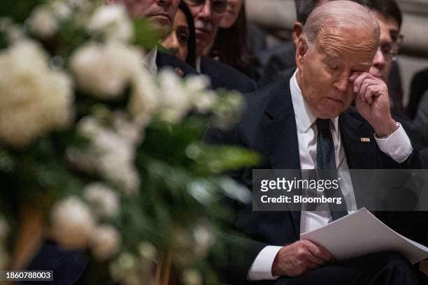 President Joe Biden wipes his eye at the funeral service of late US Supreme Court Justice Sandra Day O'Connor at the Washington National Cathedral in...