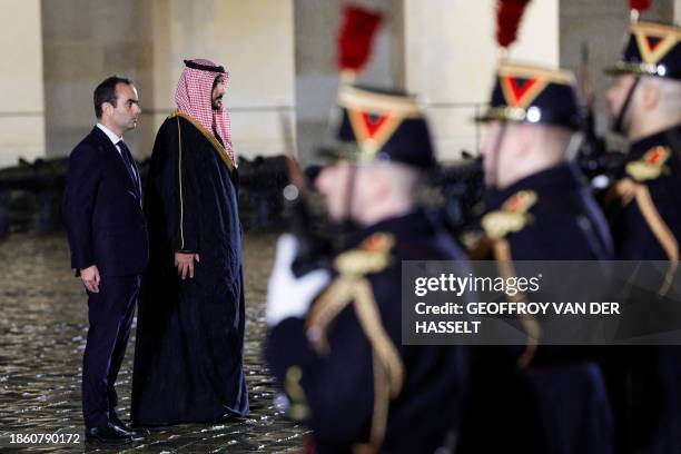 French Defence Minister Sebastien Lecornu and Saudi Arabia's Defense Minister Prince Khalid bin Salman al-Saud review a guard of honor of the French...