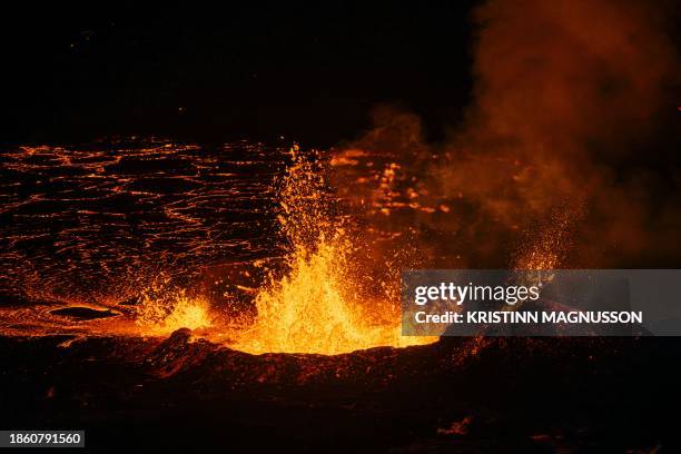 Molten lava is comming out from a fissure on the Reykjanes peninsula 3km north of the evacuate town of Grindavik, western Iceland on December 19,...