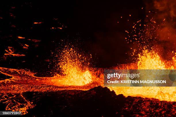 Molten lava is comming out from a fissure on the Reykjanes peninsula 3km north of the evacuate town of Grindavik, western Iceland on December 19,...
