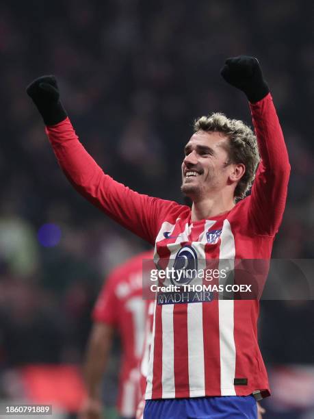 Atletico Madrid's French forward Antoine Griezmann celebrates after scoring his team's third goal during the Spanish league football match between...