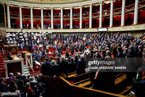 Left-wing coalition NUPES members of parliament hold signs reading "Liberte", "Egalite", "fraternite" French for 'liberty, equality, fraternity', the...