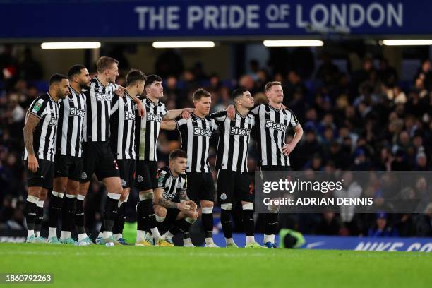 Newcastle United's players react during the penalty shoot out of the English League Cup quarter-final football match between Chelsea and Newcastle...