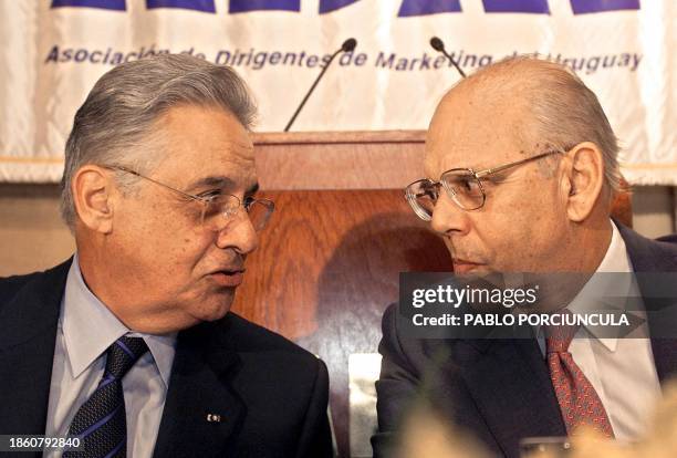 Brazilian President Fernando Henrique Cardoso and his Uruguayan counterpart Jorge Batlle, converse during a lunch offered by the Marketing Asociation...