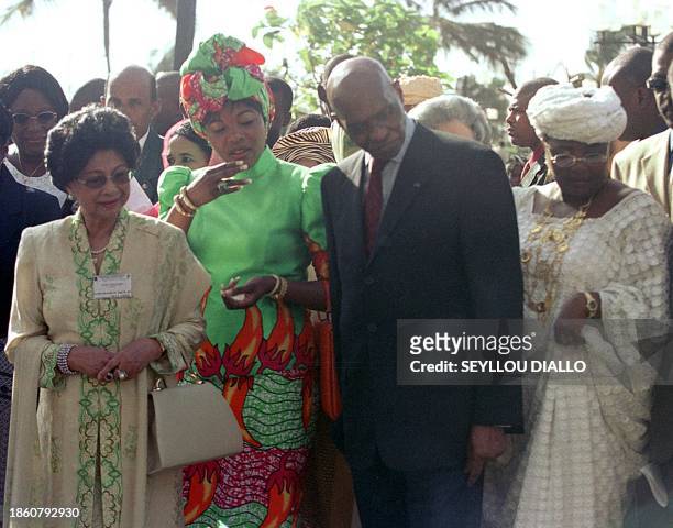 Senegalese President Abdoulaye Wade is flanked by Guinean First Lady Henriette Konte , Gabonese First Lady Edith Lucie Bongo and Sithi Hasmah Bint...