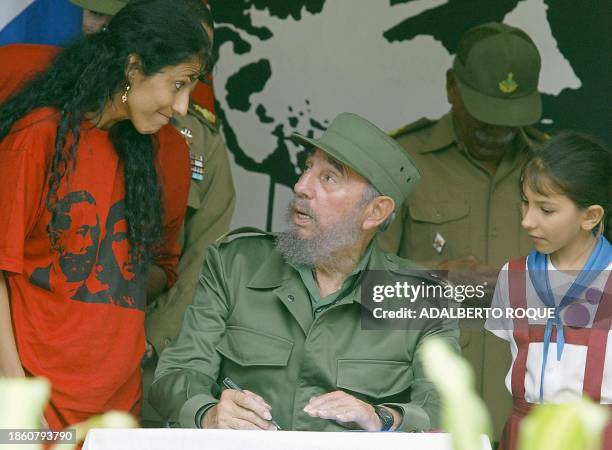 Cuban President Fidel Castro , prepares to sign 15 June in Cacahual, Havana, a referendum document enshrining socialism in the communist island's...