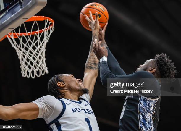 Jay Heath of the Georgetown Hoyas shoots the ball against Jalen Thomas of the Butler Bulldogs during the first half at Hinkle Fieldhouse on December...