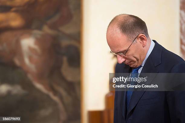 Italian Prime Minister Enrico Letta awaits the arrival of Nobel Peace Laureate Aung San Suu Kyi for a meeting at Palazzo Chigi on October 28, 2013 in...