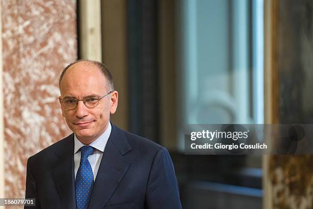 Italian Prime Minister Enrico Letta awaits the arrival of Nobel Peace Laureate Aung San Suu Kyi for a meeting at Palazzo Chigi on October 28, 2013 in...