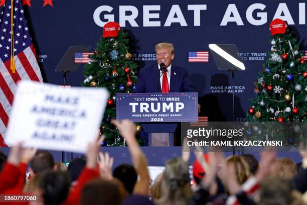 Former US President and 2024 presidential hopeful Donald Trump speaks during a campaign event in Waterloo, Iowa, on December 19, 2023. An appeals...