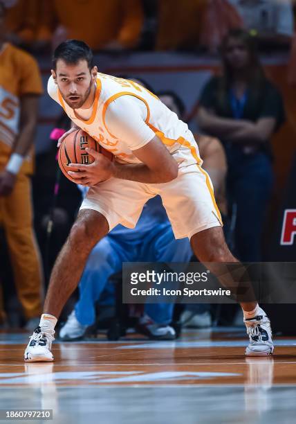 Tennessee Volunteers guard Santiago Vescovi controls the ball during the college basketball game between the Tennessee Volunteers and the Illinois...