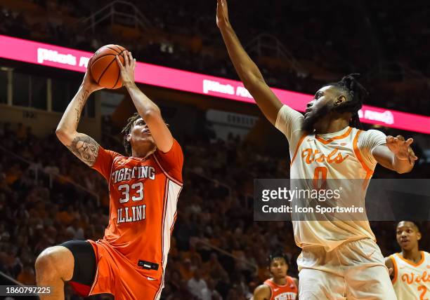 Illinois Fighting Illini forward Coleman Hawkins drives to the basket for a shot over Tennessee Volunteers forward Jonas Aidoo during the college...